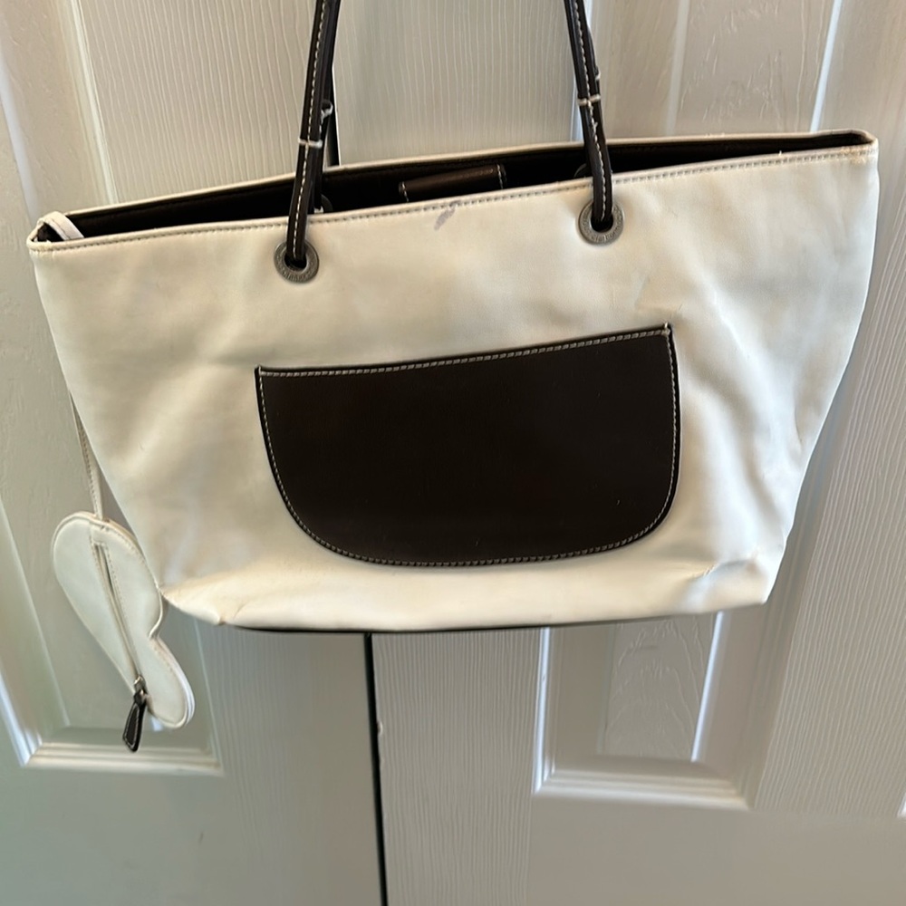 White handbag with brown pocket
